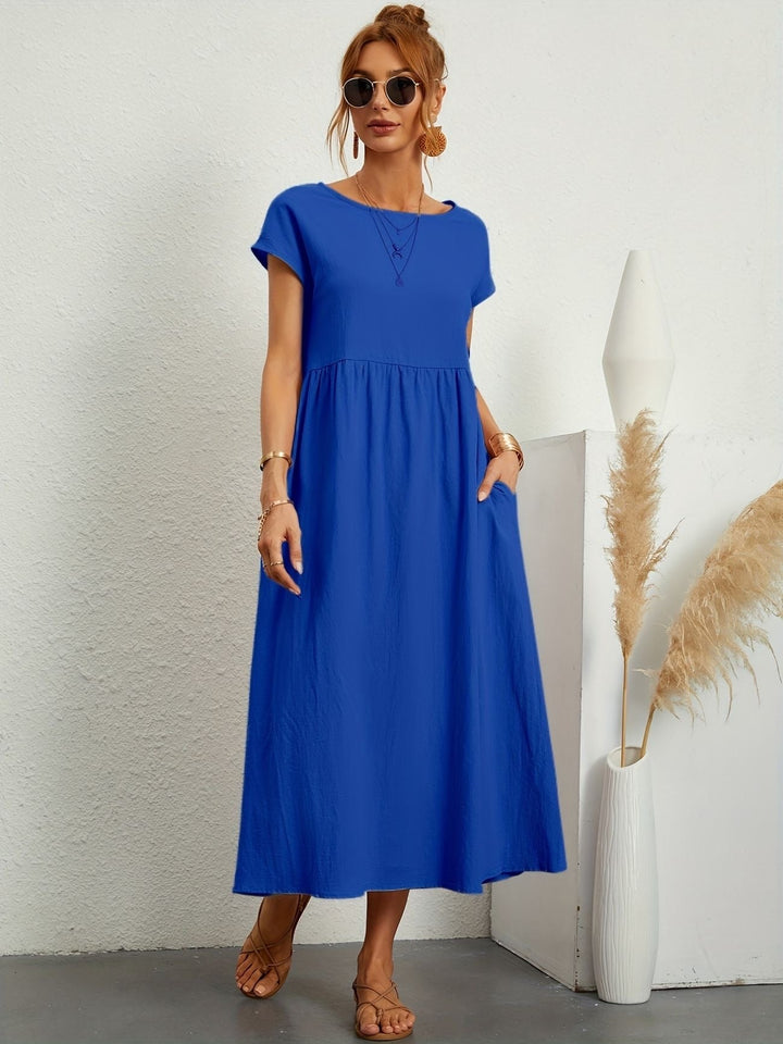 "Kimber - Midi-Relaxed Kleid mit Rundhalsausschnitt" could be rewritten as "Kimber - Midi-Relaxed Kleid mit Rundhalsdesign".