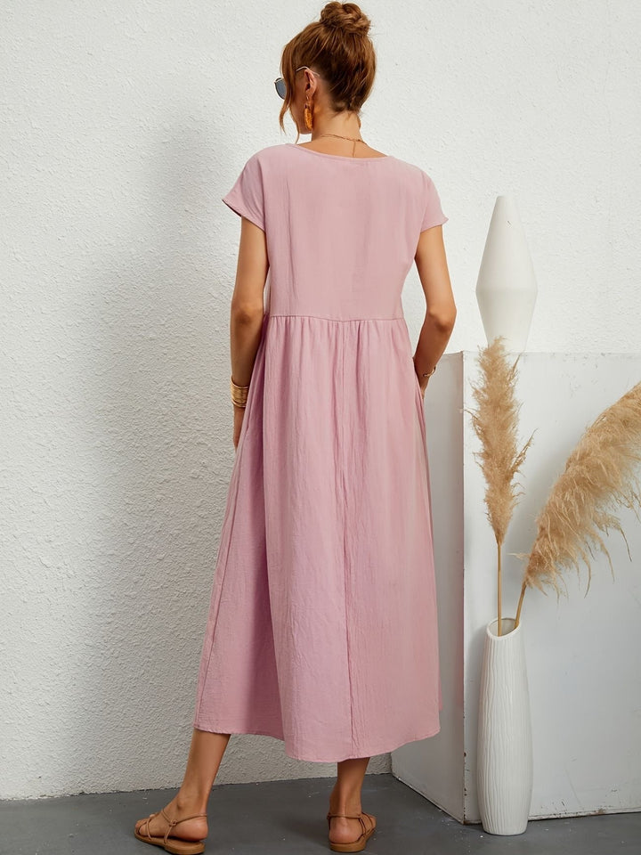"Kimber - Midi-Relaxed Kleid mit Rundhalsausschnitt" could be rewritten as "Kimber - Midi-Relaxed Kleid mit Rundhalsdesign".