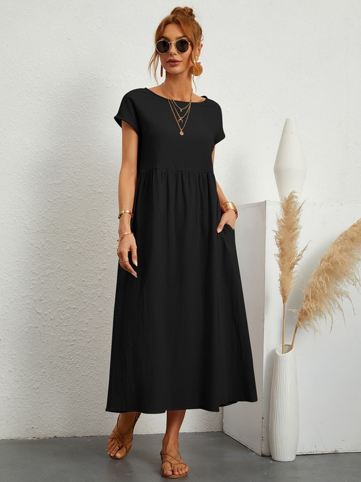 "Kimber - Midi-Relaxed Kleid mit Rundhalsausschnitt" could be rewritten as "Kimber - Midi-Relaxed Kleid mit Rundhalsdesign".